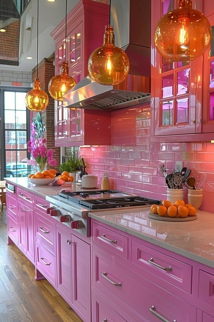 Vibrant pink kitchen with modern appliances